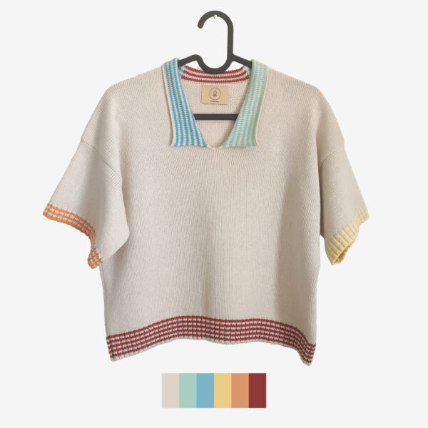 The catalogue shot of a plain beige knit t-shirt, featuring coloured stripes on waist, arm and neck bands.