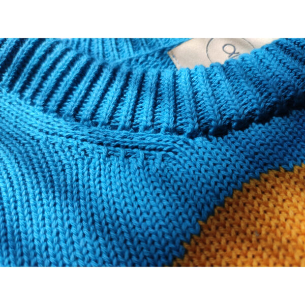 A close up shot of the neck band on the ''Nuuk'' landscape sweater.