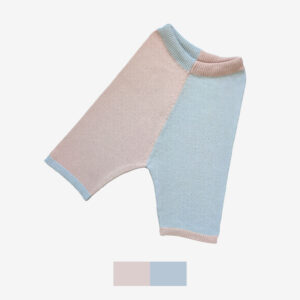 A catalogue shot of two coloured knit shorts, with one leg pink and the other blue.