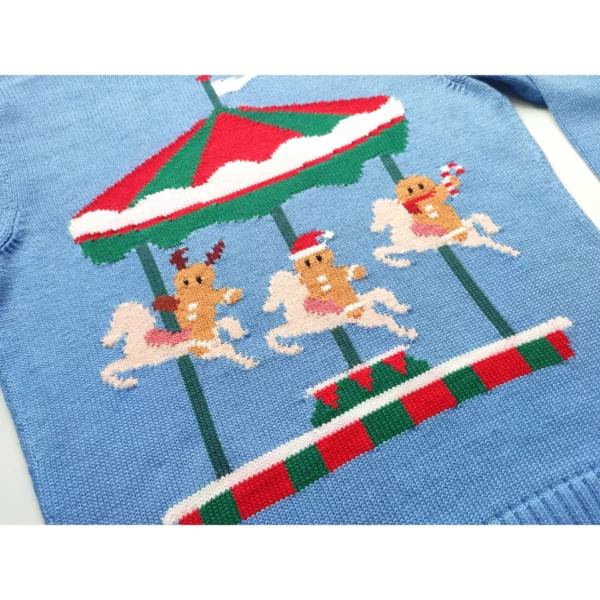 A close up shot of the handmade sweater featuring three gingerbread men riding a merry-go-round, with various Christmas related items on them, like a striped candy and a santa hat.