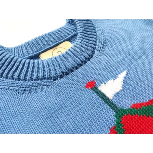 A close up shot of the Cookie-Go-Round sweater by Knyt, focusing on the fine details of the neck band.