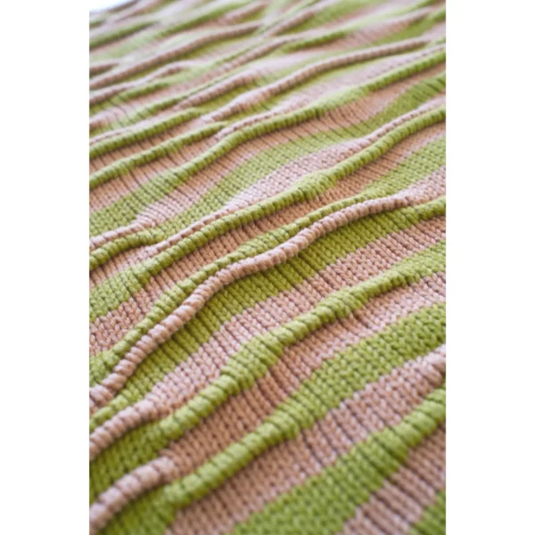 A close-up shot of Breezer (Caramel), capturing the intricate bumpy texture in detail. The unique knitting technique and warm tones of Soft Caramel and Chartreuse come to life in this handmade piece.