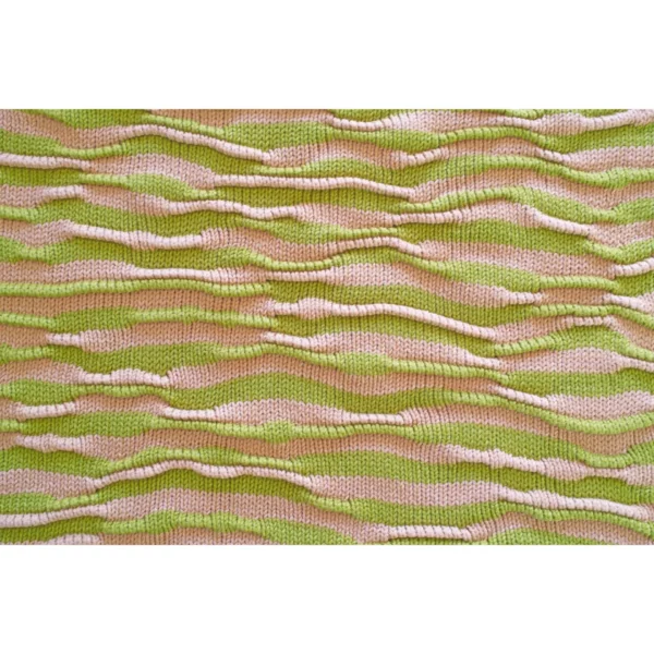 A panoramic shot of Breezer (Caramel), focusing on the wavy bumpy texture. The handmade knit t-shirt’s unique design and warm tones of Soft Caramel and Chartreuse are beautifully highlighted in this wide-angle view.