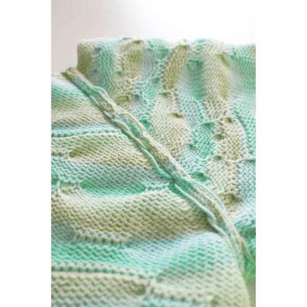 A close-up shot of the inside of Breezer (Mint), highlighting the careful craftsmanship of the threads. The intricate connections and detailed knitting technique are beautifully captured, showcasing the skill and precision behind this handmade piece