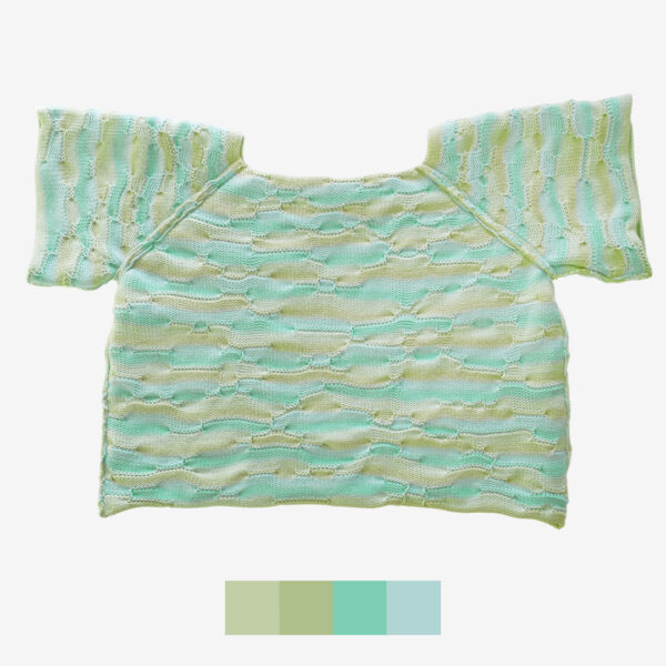 A catalog-style shot of Breezer (Mint), showcasing the inside of the handmade knit t-shirt. The unique bumpy texture and intricate knitting technique are highlighted from the inside out, emphasizing the craftsmanship and warm tones of Minty Ice Blue and Muted Olive.